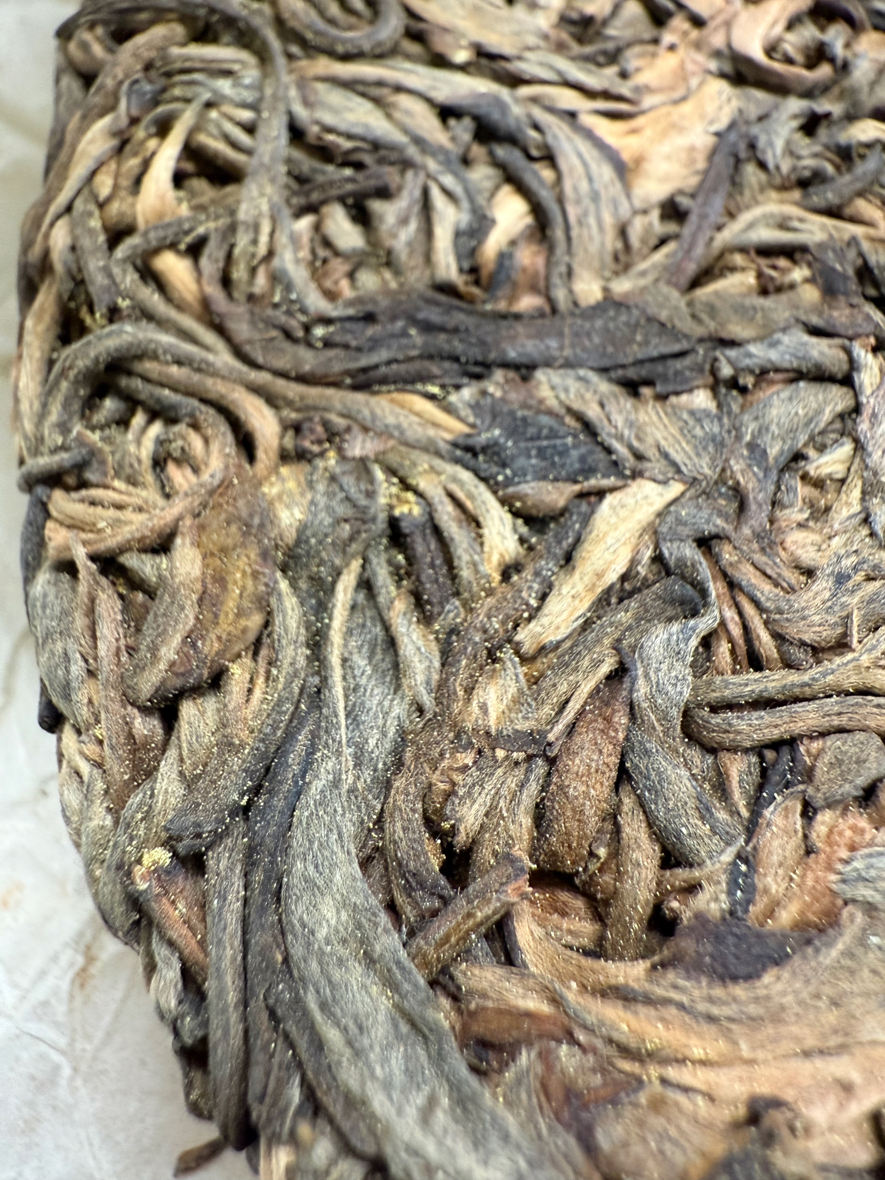 Close-up view of yellow spots on pu-erh tea